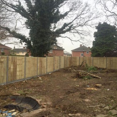 Starting a garden project by putting up a fence first.